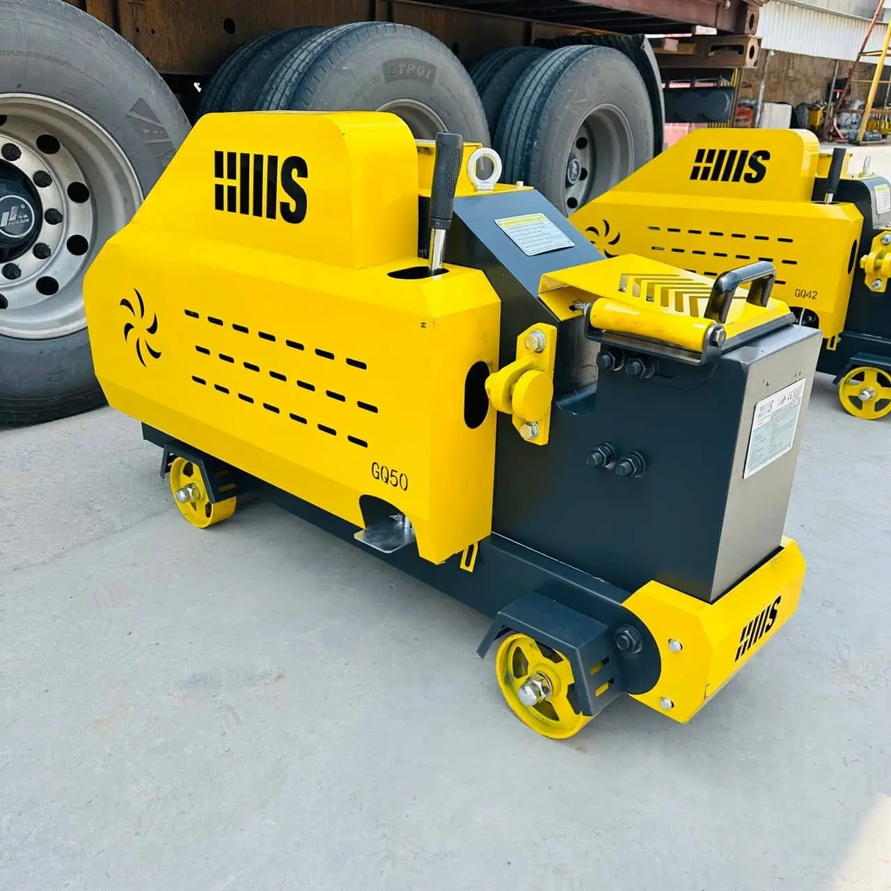 Close-up detail view of bar cutting machine blade and cutting mechanism for TMT rebar