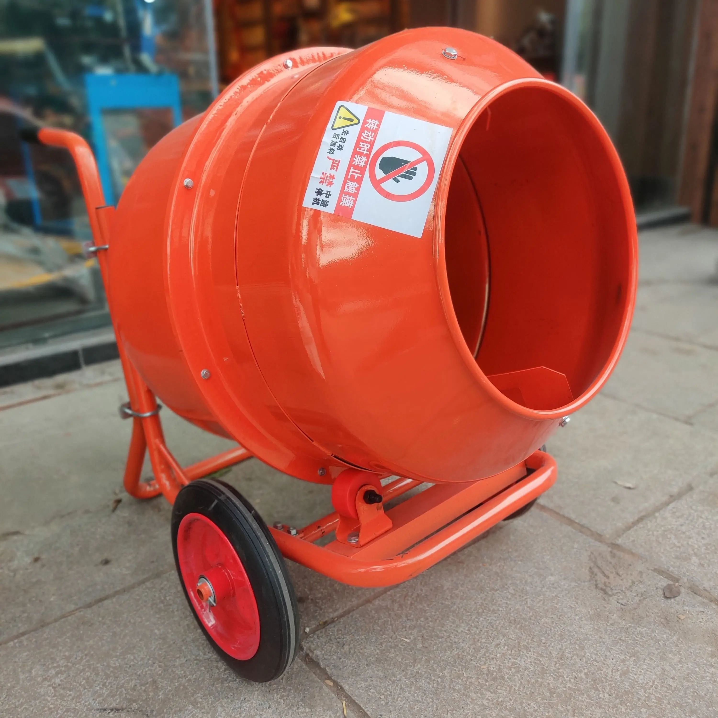 Hutaib cement mixer in operation producing concrete at Bengaluru construction site