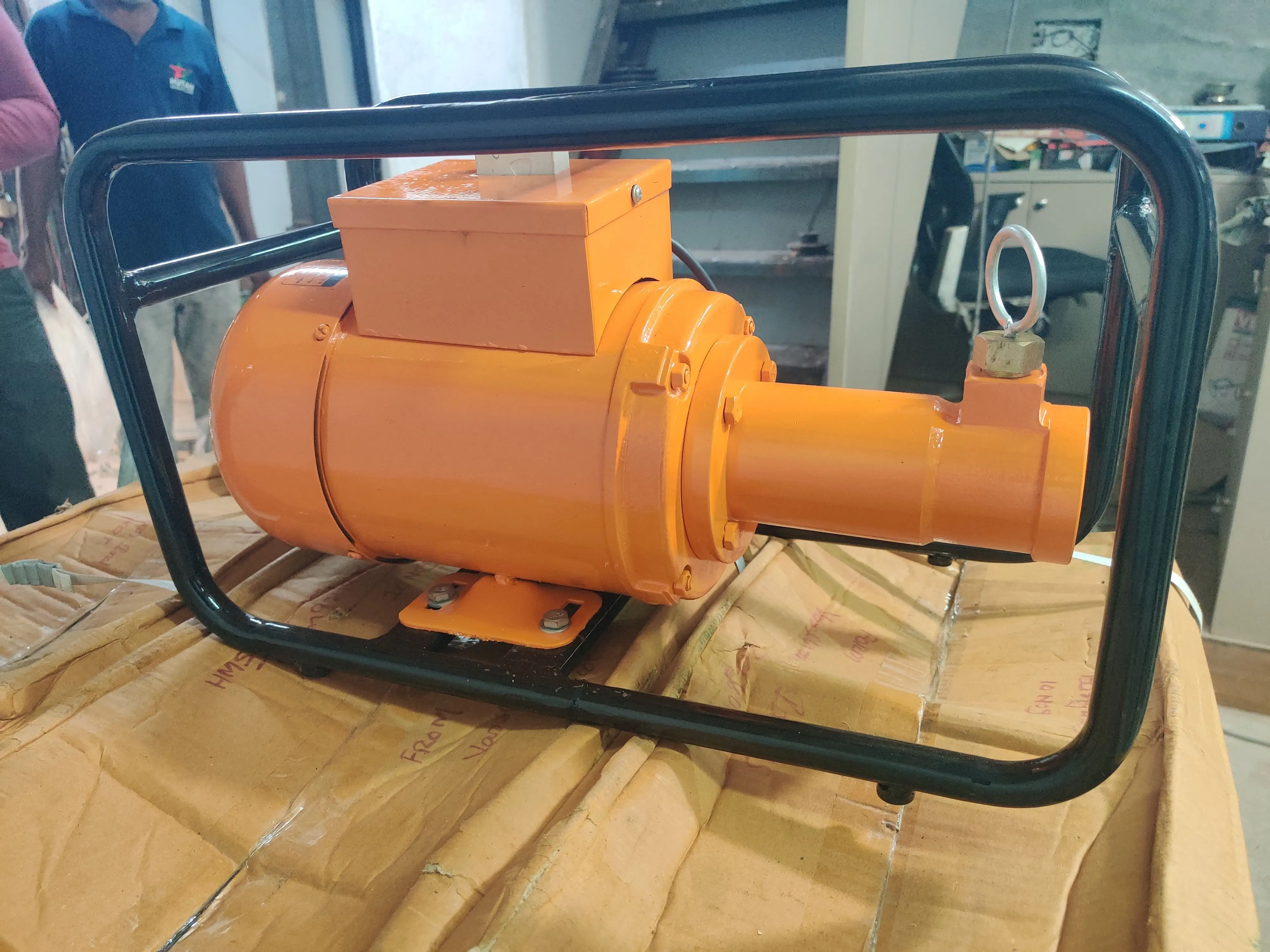 Hutaib needle vibrator in operation consolidating column concrete at Bengaluru construction site