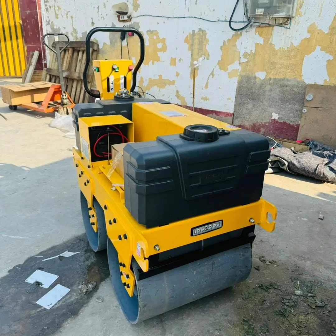 Close-up detail view of road roller operator controls and drum mechanism