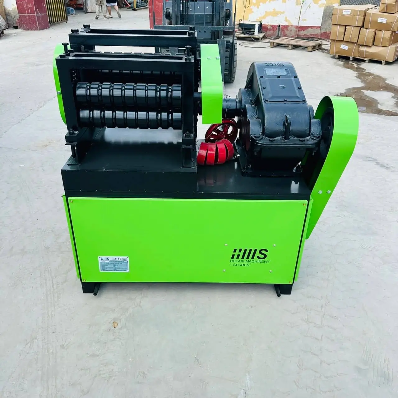 Close-up detail view of scrap straightening machine motor and drive mechanism