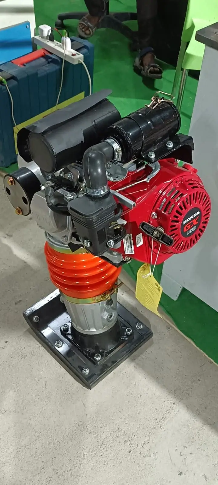 Jumping rammer compacting trench backfill