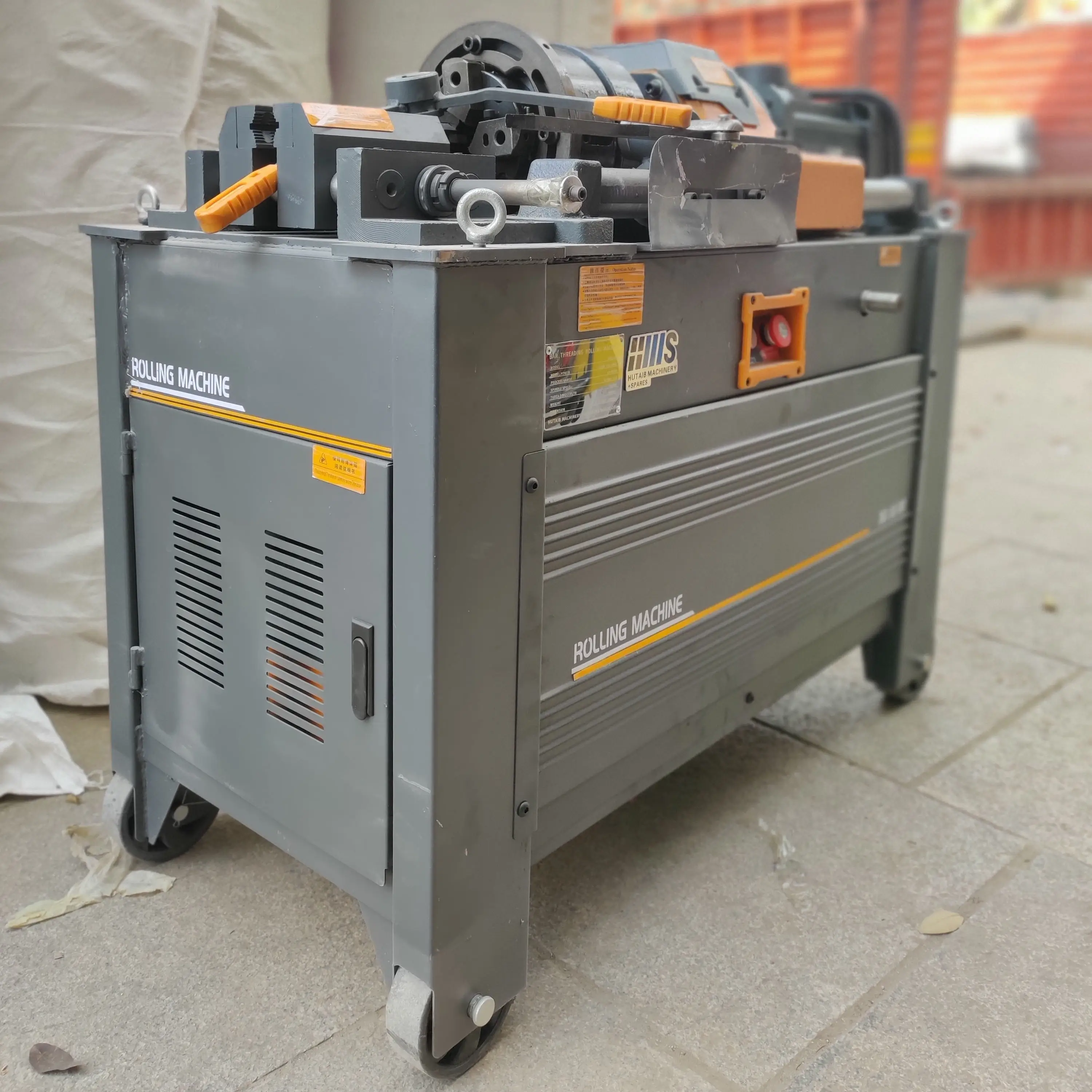 Threading machine creating threads on rebar for coupler connection